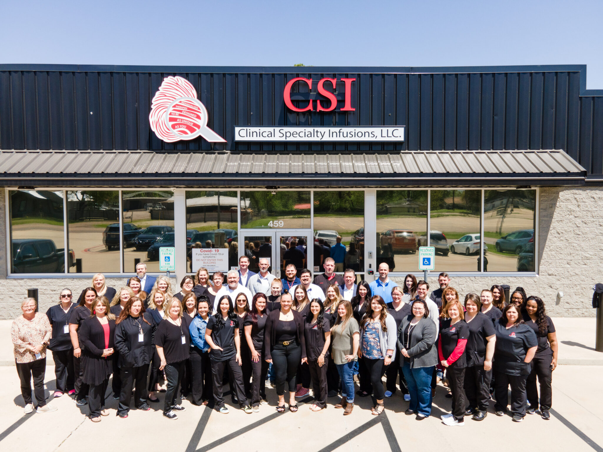 CSI Pharmacy Clinical Specialty Infusions, LLC group standing outside of the office.