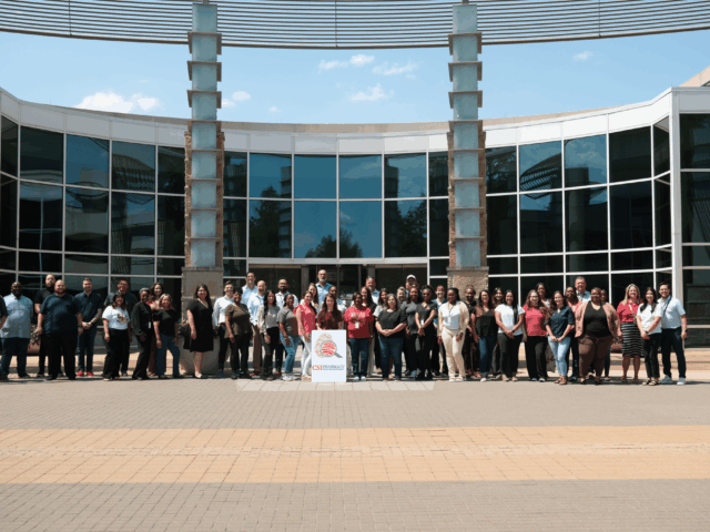 CSI Pharmacy team in front of their office in Plano, Texas
