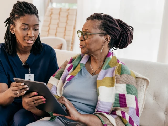 Nurse educating patient on neurological conditions.