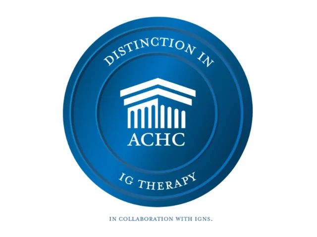 Blue Emblem Representing ACHC Distinction in Ig Therapy in Partnership with IgNS