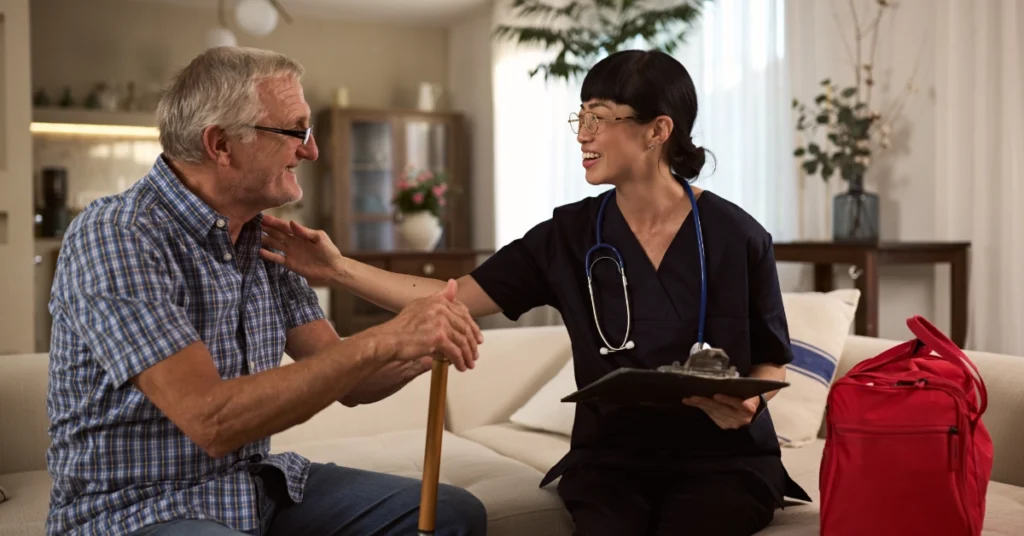 Home Infusion Nurse Visiting Elderly Man for Checkup and Support.